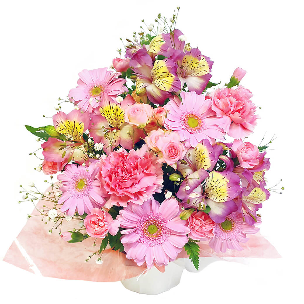 メインにピンク系の季節の花材を使用してアレンジに仕上げます